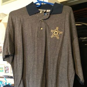 Golf shirt with embroidered Secret Service star.